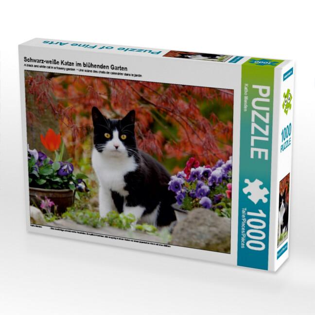 Schwarz-weiße Katze im blühenden Garten (Puzzle)